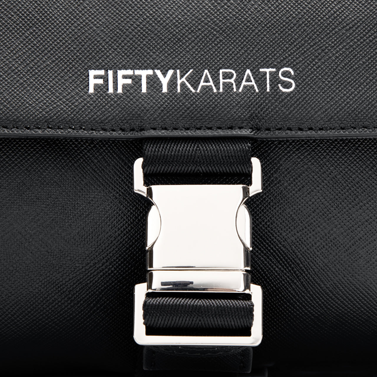 Fifty Karats Quest Messenger Bag Front with Fifty Karats logo on front pouch with metal buckle enclosure detailed