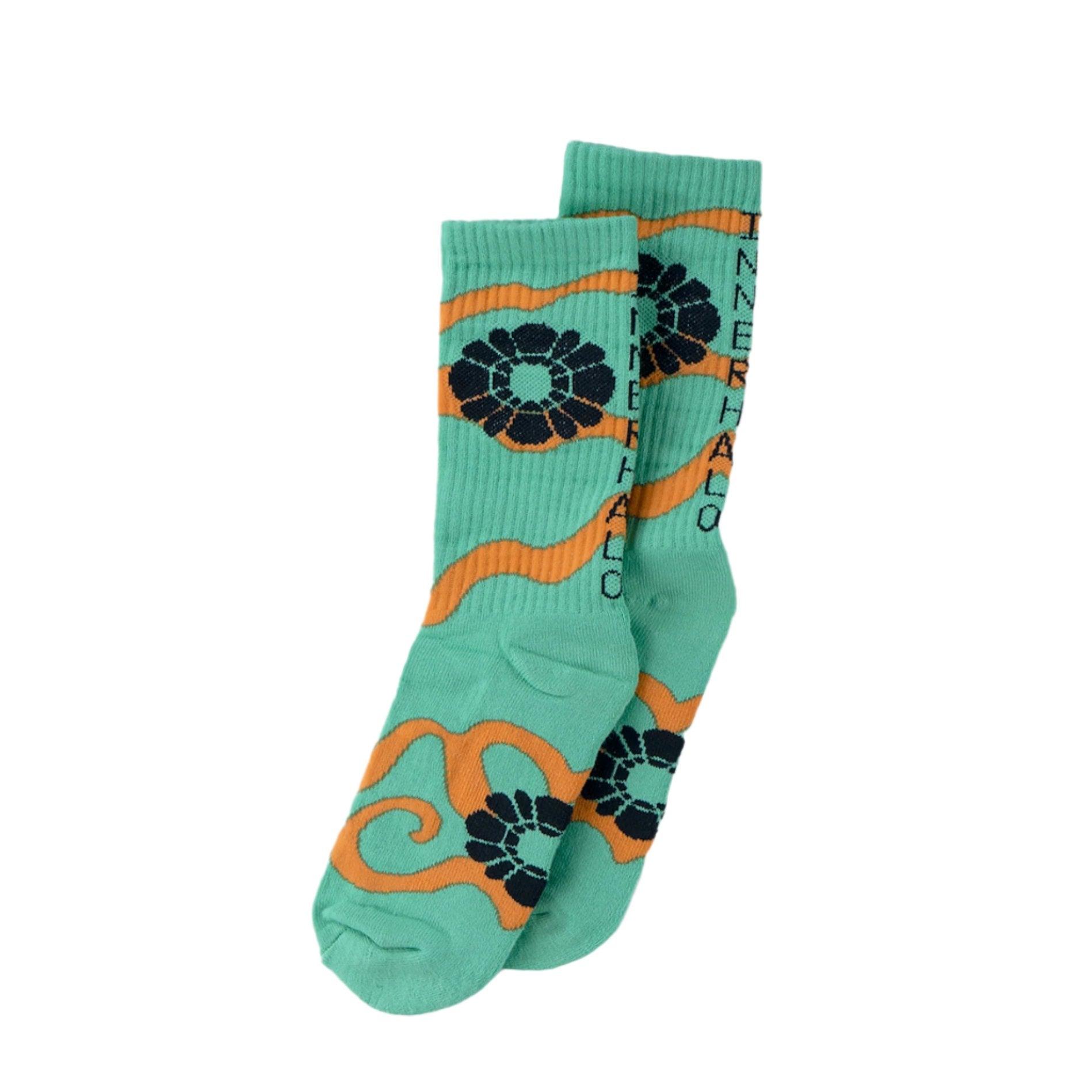 Haloe Blü Inner Halo Socks in green with orange swirl design