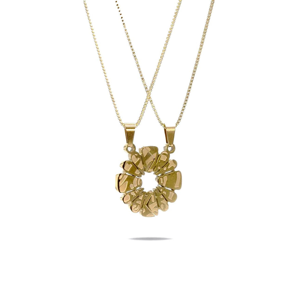 Haloe Blü’s Half Haloe Pendant, designed by Carelaa™ and Twelve’Len™. Finished in 18k gold plating, this pendant delivers a bold yet refined look. Paired with a matching gold-plated necklace for each side of the pendant.