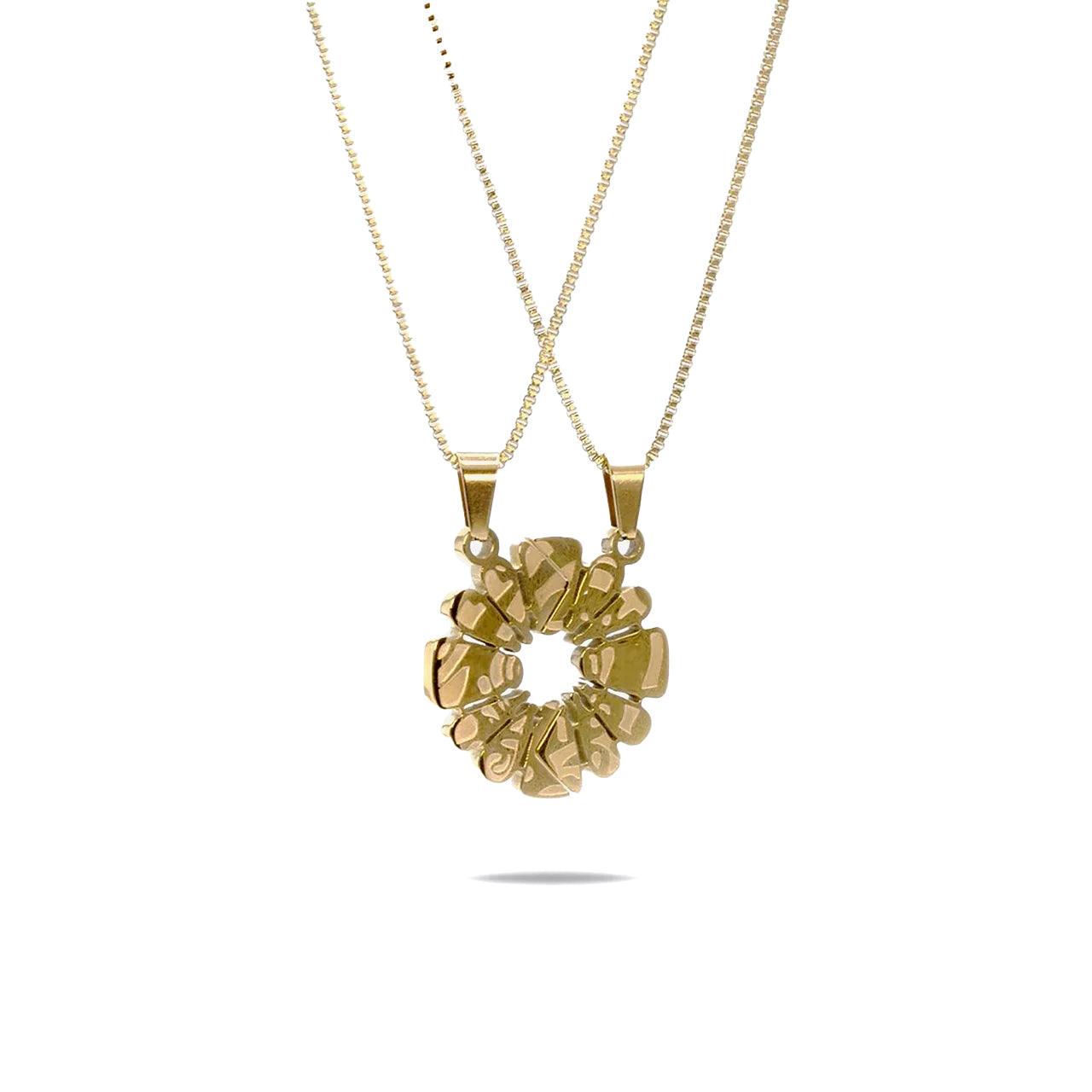 Haloe Blü’s Half Haloe Pendant, designed by Carelaa™ and Twelve’Len™. Finished in 18k gold plating, this pendant delivers a bold yet refined look. Paired with a matching gold-plated necklace for each side of the pendant.