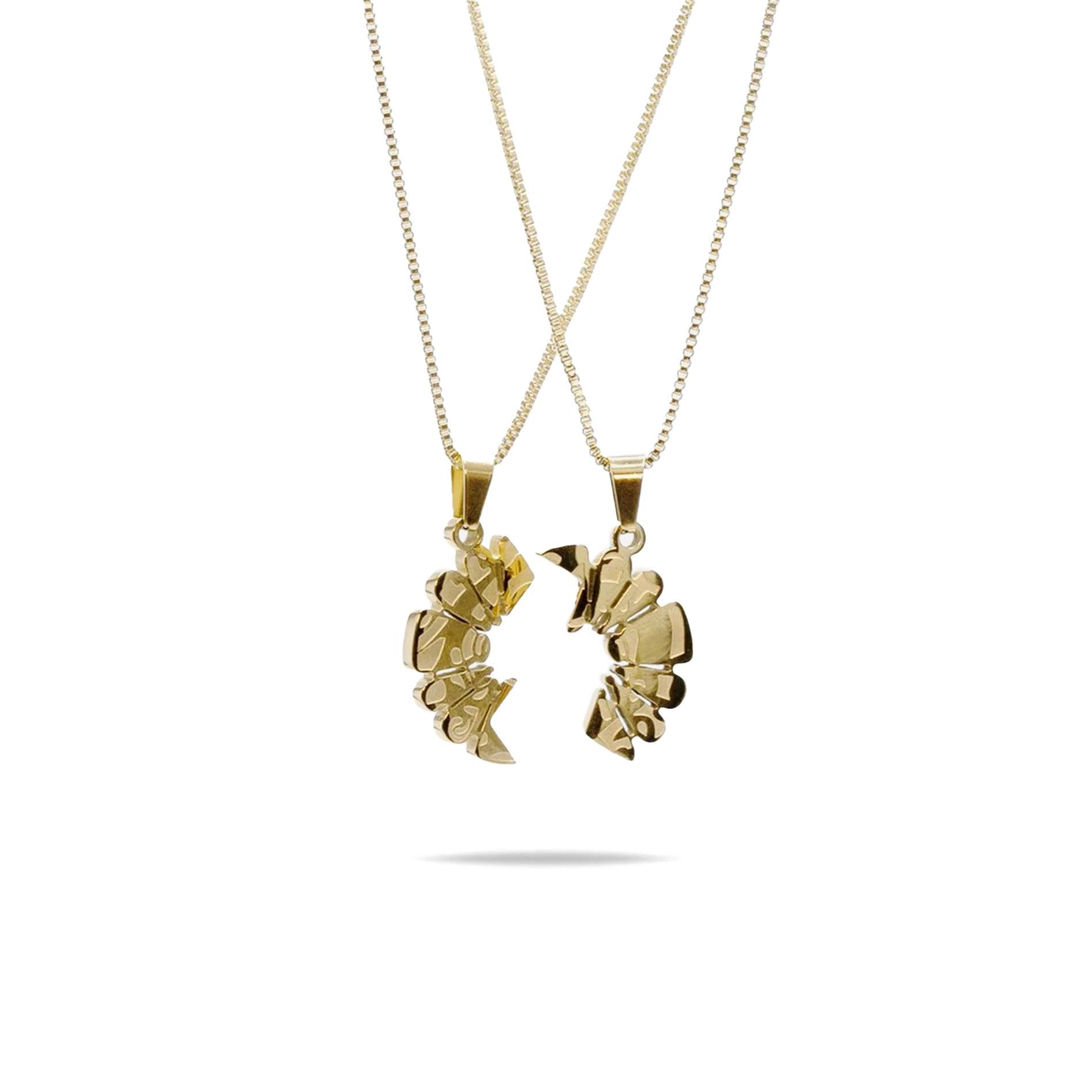 Haloe Blü’s Half Haloe Pendant, designed by Carelaa™ and Twelve’Len™. Finished in 18k gold plating, this pendant delivers a bold yet refined look. Paired with a matching gold-plated necklace for each side of the pendant.